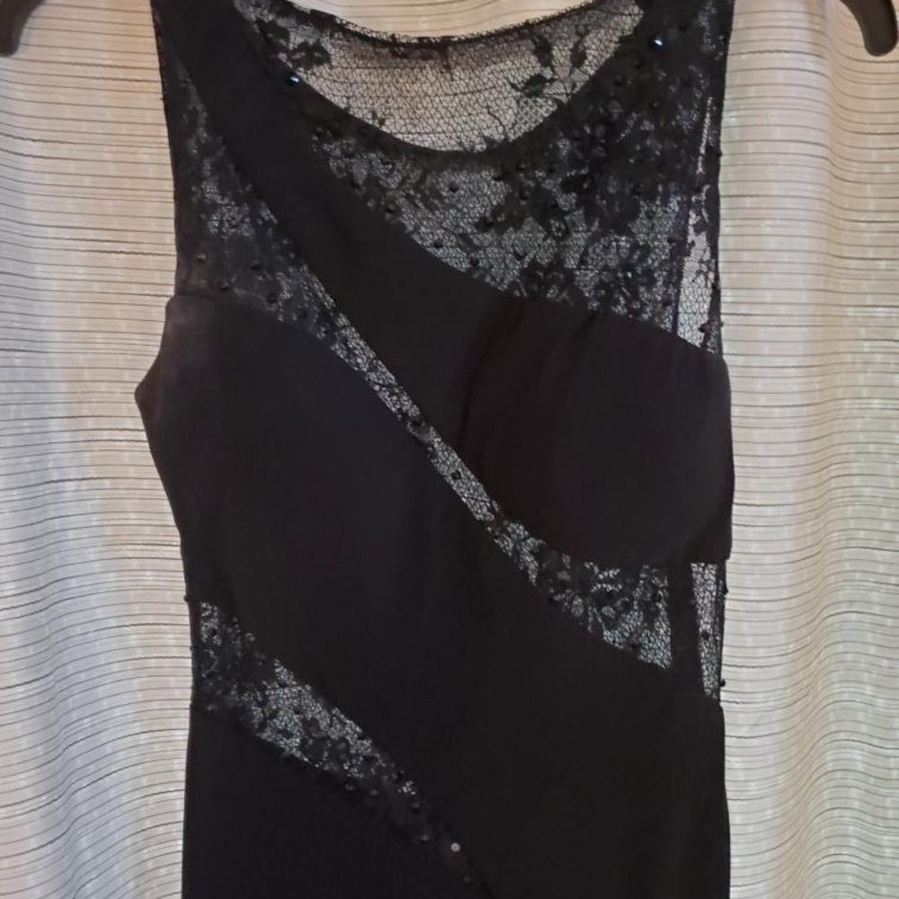 Black prom dress. Lacy on top with rhinestones, super comfortable.
